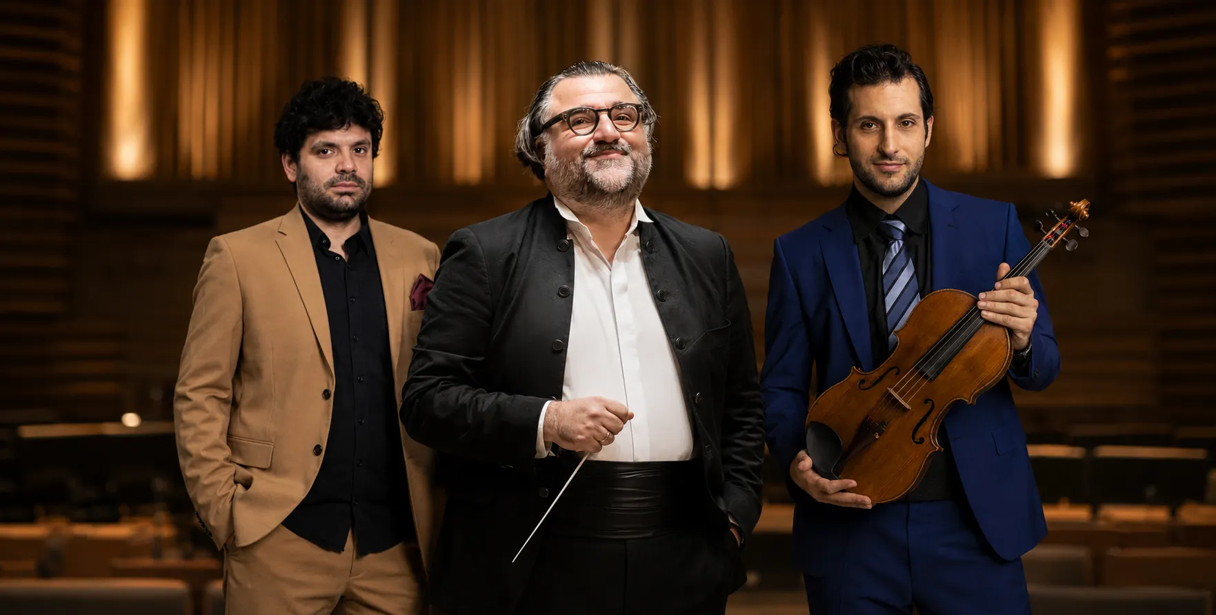 Conductor Georgios Balatsinos and cellist Pablo Ferrández in a cinematic concert hall portrait, standing in the middle of Iason Keramidis and Ilias-Ion Livieratos, elegant orchestral backdrop.